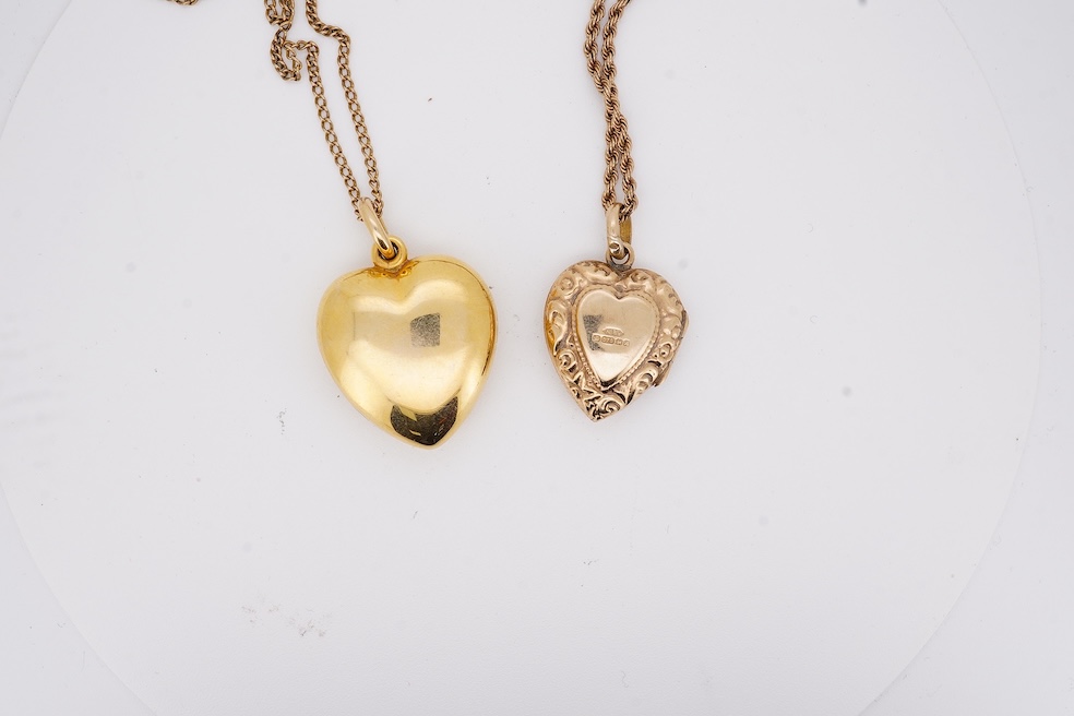 A modern embossed 9ct gold heart shaped locket, 21mm, on a similar 9ct gold rope twist chain, 46cm, together with one other yellow metal heart shaped locket, on a yellow metal chain, gross weight 14.5 grams. Condition -
